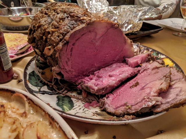 Medium-rare 15-lbs rib roast, with first slice taken out of it