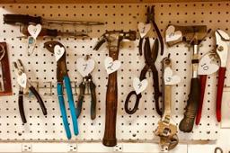 Thumbnail sized: Tools hanging on a peg board
